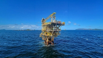 Compact offshore production platform standing in calm open water
